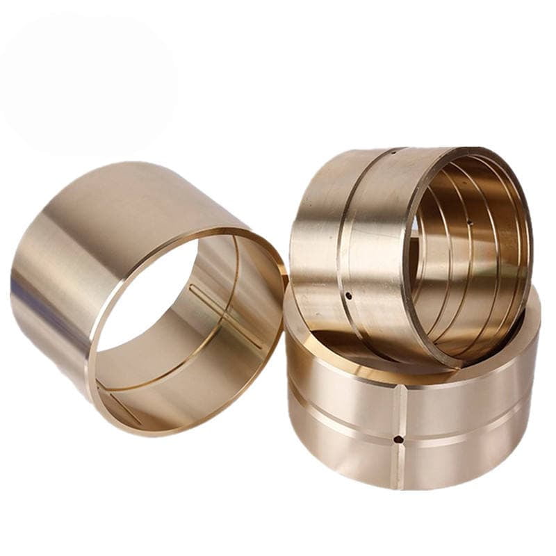 A CNC machine precisely cutting oil grooves into a bronze bushing