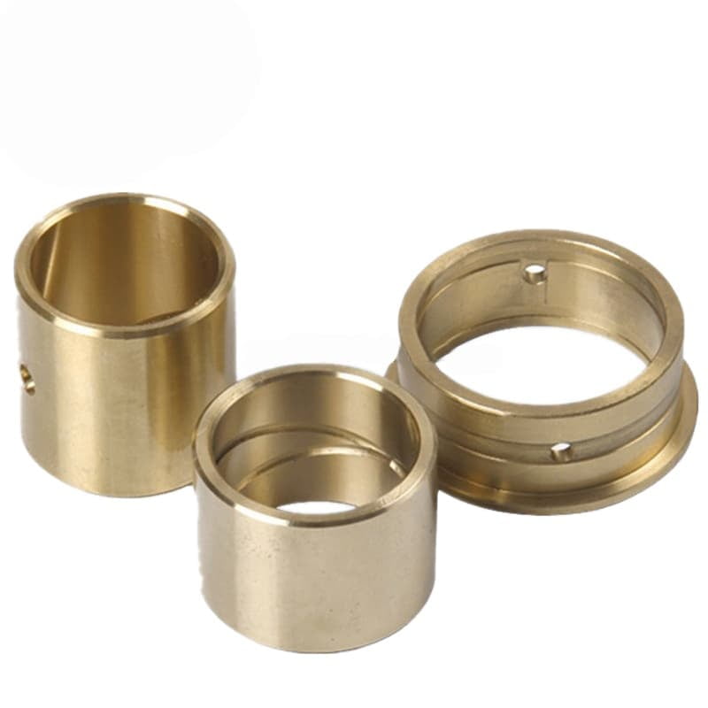 A solid bronze bushing with an oil groove machined into it